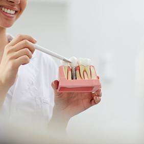 a dentist explaining how dental implants work