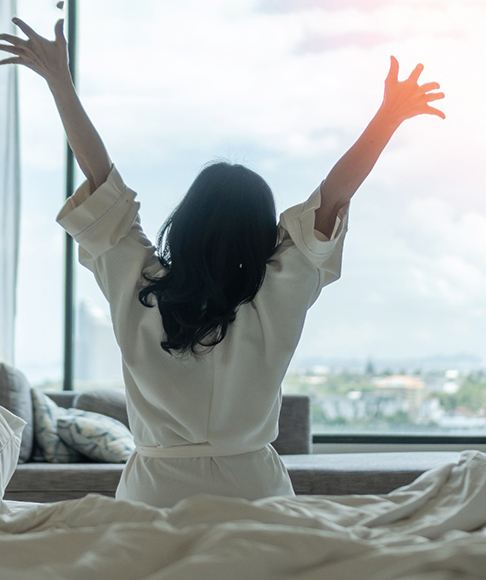 woman waking up with a lot of energy 