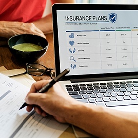 Person looking at insurance plan information on computer