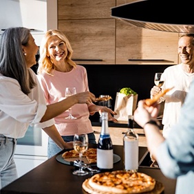 Mature friends enjoying a meal together