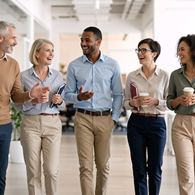 Group of professionals walking in office setting