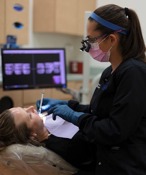 Woman with red gums before gum disease treatment