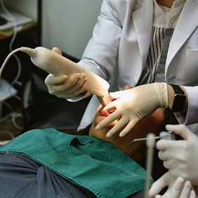 Vero Beach implant dentist scanning patient's teeth