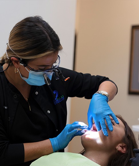 Patient receiving oral cancer screening