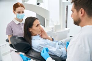 Concerned patient talking to dental team